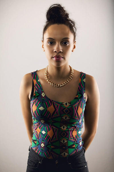 Pretty female fashion model posing on grey background