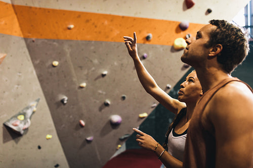 Man and woman at an indoor rock climbing gym