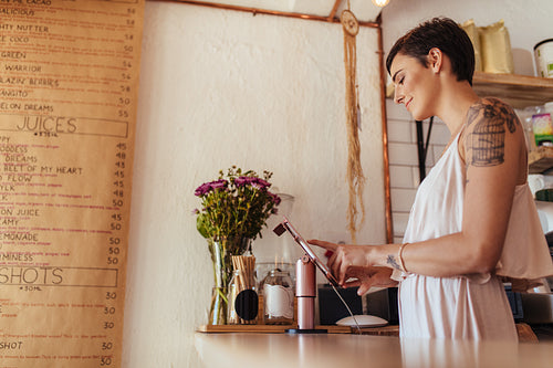Woman entrepreneur at her juice shop