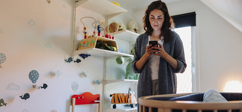 Woman on maternity leave taking care of her working and baby