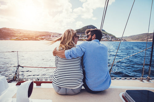 Romantic young couple on a boat trip