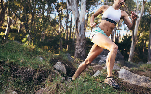 Athlete running in a forest