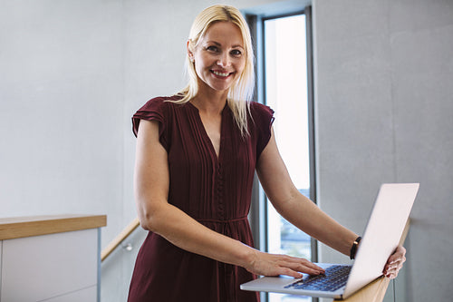 Woman in the office with a laptop