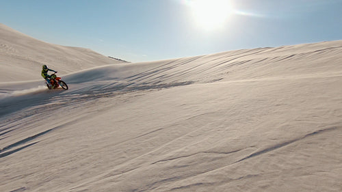 Leaning a motorcycle over sand dunes