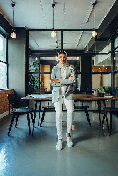 Young businesswoman wearing a hijab in a modern workplace