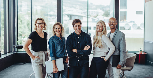 Multi-ethnic business team smiling in office