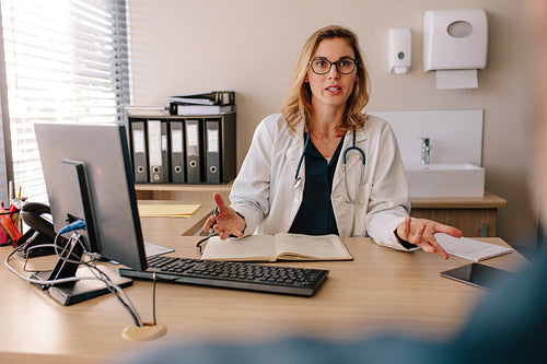 Female doctor consulting a patient in clinic