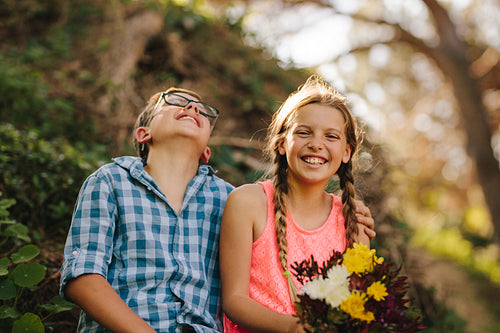 Happy kids in love sitting in a park