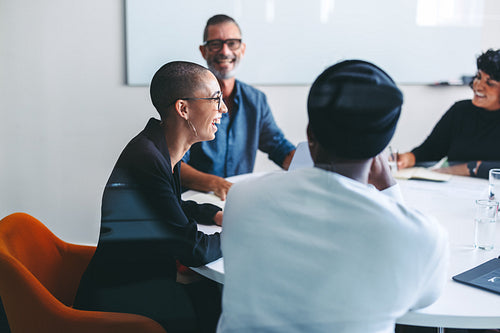 Happy businesspeople smiling in a meeting