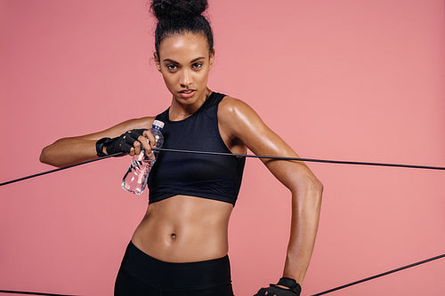 Strong woman exercising with elastic band