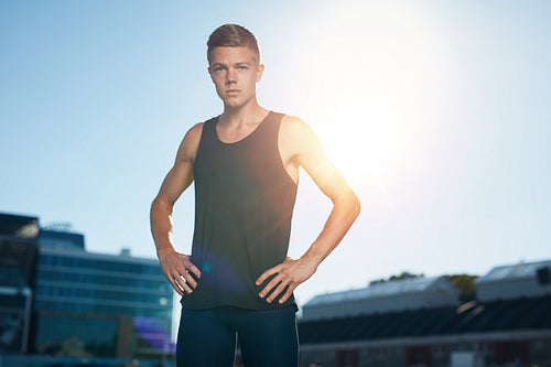 Professional male athlete on race track