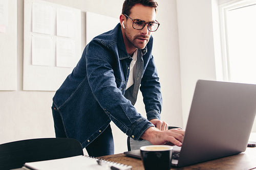 Businessman connecting to an online meeting in his office