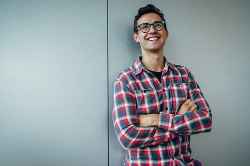 Young businessman looking away and smiling
