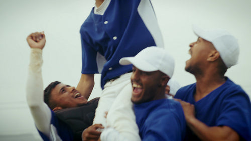 Baseball team celebrates a triumphant game victory