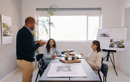 Small team of managers collaborating on a project in an office setting