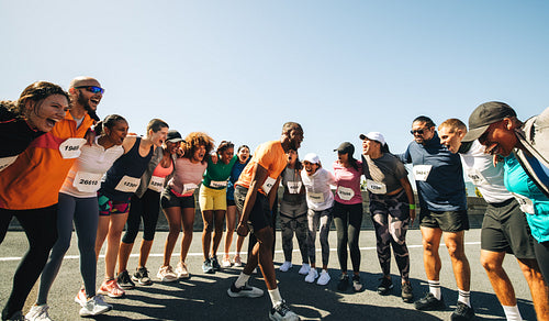 Diverse group of runners cheering for race day encouragement