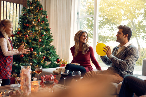 Young family having fun at home during christmas