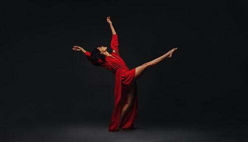 Contemporary female dancer performing on studio