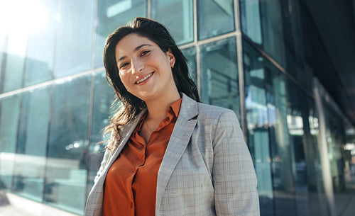 Smiling businesswoman looking at the camera outdoors
