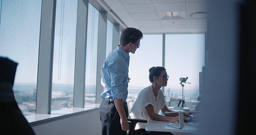 Colleagues working together in office