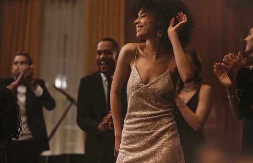 Beautiful african woman dancing at gala event