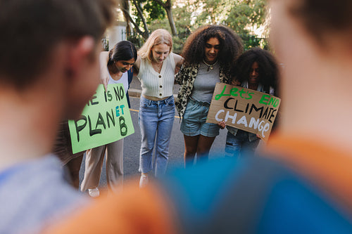 Multiethnic young people demonstrating against climate change
