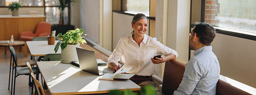 Women discussing new project with colleague