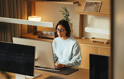 Desk job: woman working on a computer in the office