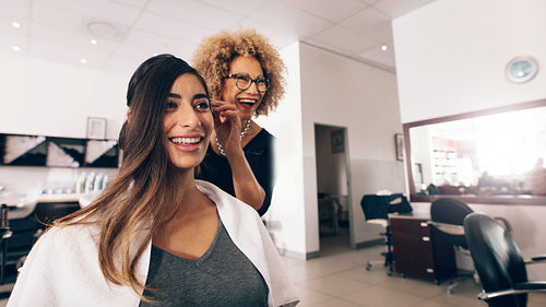 Woman hairdresser at work in salon