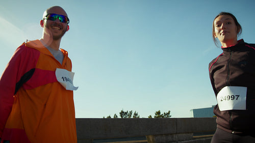 Runners celebrate their athletic achievement