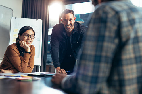 Happy and positive business team in meeting