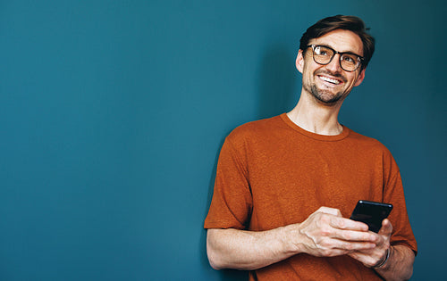 Man using a mobile phone in a business office
