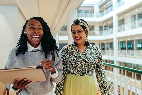 Female colleagues smiling together