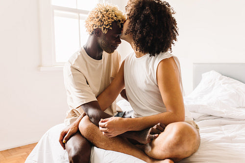 Affectionate young gay man kissing his lover