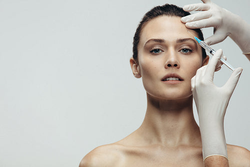 Anti aging serum shot on forehead