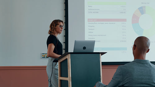 Woman addressing a business conference
