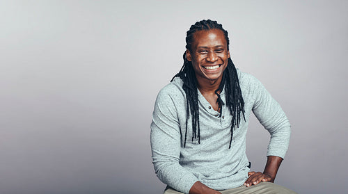Cheerful african man with dreadlocks