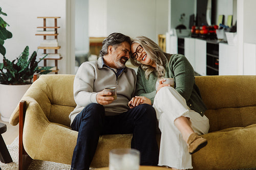 Woman sits with her senior partner on the sofa