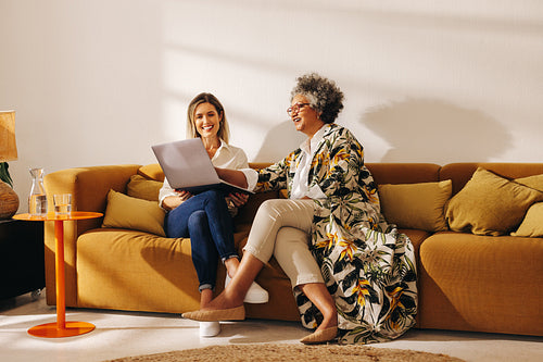 Happy businesswomen working together in a lobby