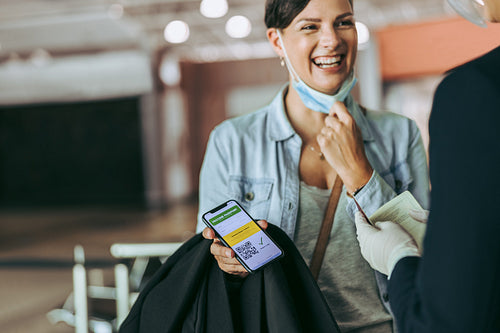 Woman traveler at airport check-in during pandemic