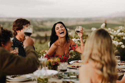 Group of people having great time at dinner party