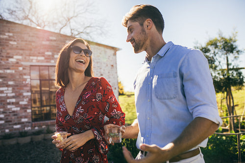 Multi-ethnic millennial couple enjoying a party outdoors