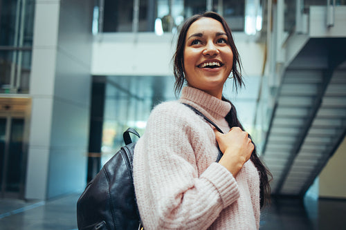 Smiling university student in campus