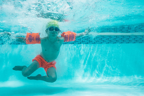Kid learning to swim