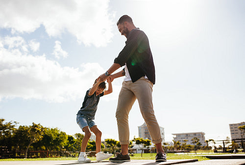 Father and son playing outdoors