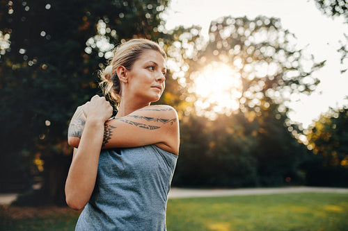 Female exercising at the park in morning