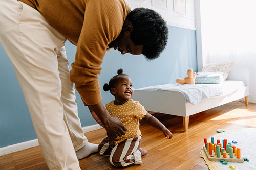 Family loves playtime in cozy home.