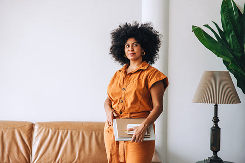 Young businesswoman looking away thoughtfully in an office