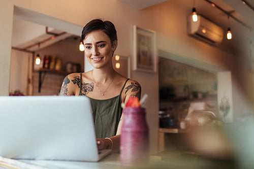 Woman working on laptop computer