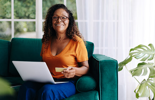Senior credit card holder claiming her pensioner discounts in online stores